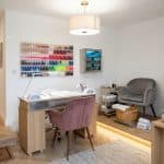 Fully set up nail suite with manicure table and polish display