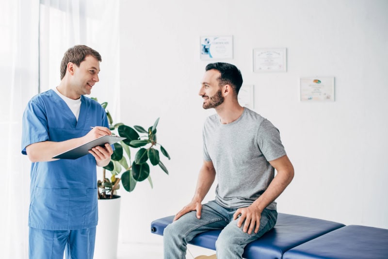 massage therapist and client talking